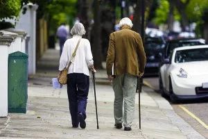 Elderly Couple Walking Properly with Canes