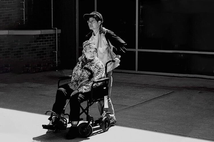 Woman Being Pushed in Transport Wheelchair