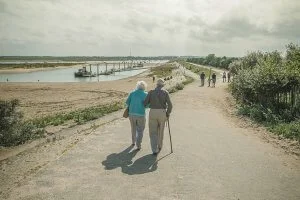 Elderly Couple Walking with Cane