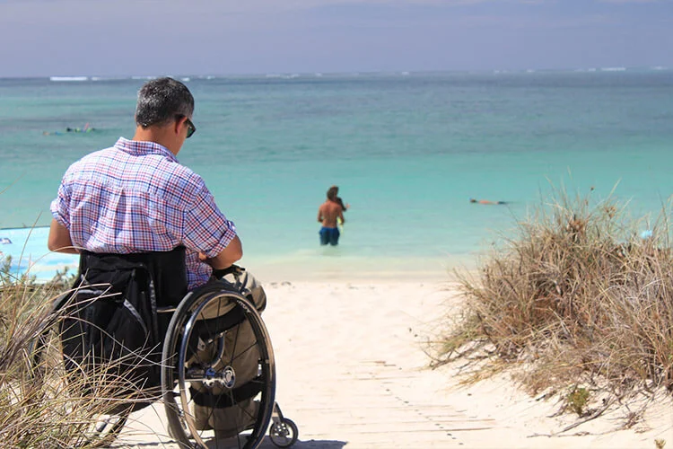 Man in Wheelchair on Wheelchair Accessible Beach